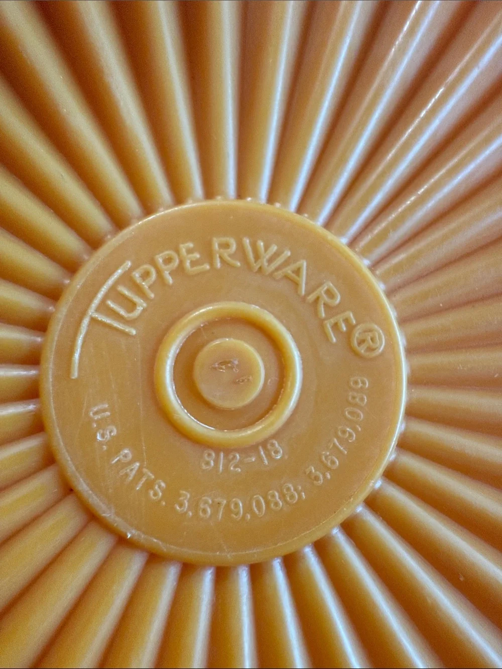 Tupperware replacement lids in orange and burgundy